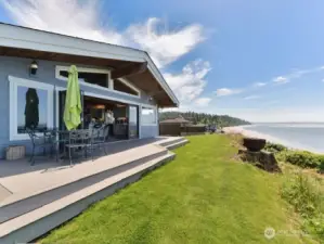 Large trex decking off the living room.  Nano doors folds back to open the living spacing to the outdoors.