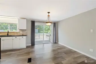 Dining space with slider to back deck. Perfect for entertaining!