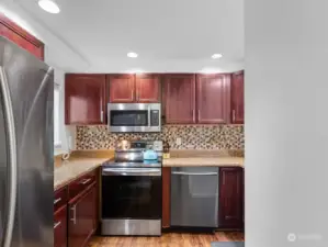 Updated kitchen with stainless steel appliances.