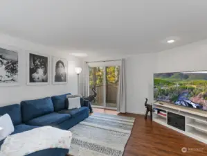 Spacious living room with Luxury Vinyl Plank flooring.