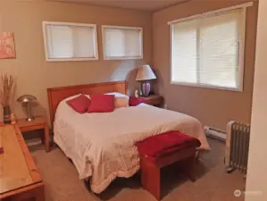 Primary bedroom with a half bath.