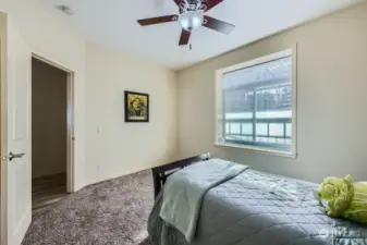 Primary suite includes a private bathroom and walk-in closet