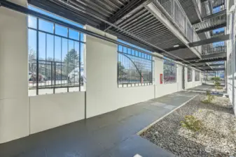 Ground level home with covered walkway.