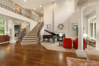 Formal Living room with a gas fireplace. Sweeping hardwoods throughout the lower level.
