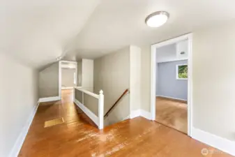 Large landing space upstairs could make a cute little office space or crafting nook.