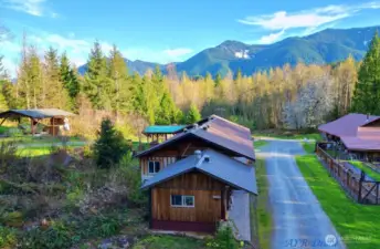 Aerial shot of House w/ auxiliary kitchen, shop and garden and additional covered parking