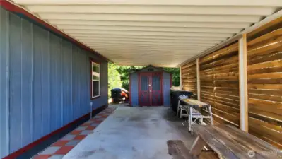 Carport, covered picnic area and shed