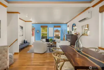 The main floor has an open plan, with kitchen, dining and living flowing to east-facing balcony.