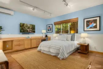 Main floor spacious room functions well as a second primary bedroom.