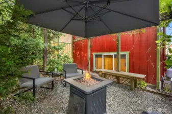 To the rear of the home find this sweet garden/patio with room for entraining and relaxing.