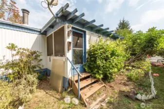 Door to backyard from sunroom