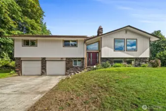 Love the clean classic lines of this home on 5 acres!