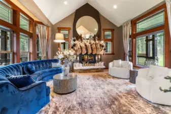 Family Room with wood fireplace, and wood wrap windows throughout
