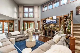 Bask in natural light from countless windows and two 8 foot sliding glass doors, then cozy up beside one of three fireplaces