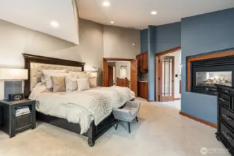 A luxe primary retreat with a double-sided gas fireplace… and yes, there’s a wet bar with sink