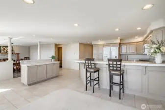 Good picture shows transition to the dining room with fireplace and view.