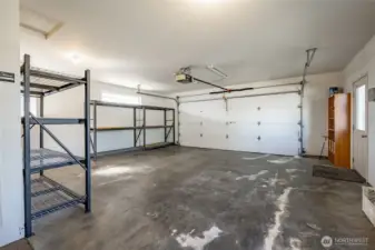 527 sq. ft. garage with storage racks that stay. Furnace is in the garage.