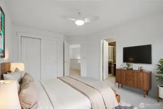 Primary bedroom 2 with ceiling fans and an ensuite bathroom