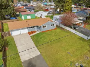 This home is situated on a large lot with alley access in back to a spacious 3 bay shop!