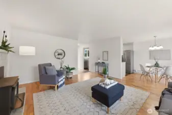 Another angle showing the layout of the living room and dining area.