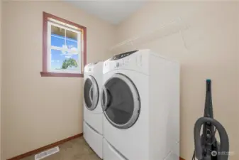 Large laundry with an exit to the garage