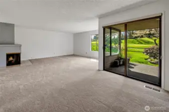 Looking in from the kitchen to the dining and living area