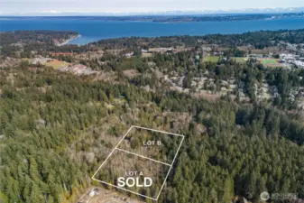 Lot B sky shot, Fox Den road seen along the right side of the property line out to Sportsman