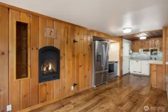 Kitchen with pantry door next to fridge allowing for additional storage space.