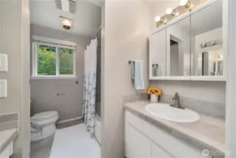 Full bath with dual vanities