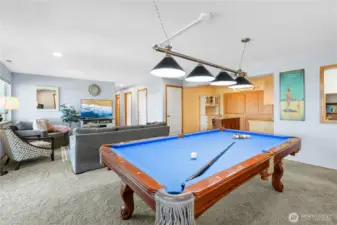 The lower level comes complete with a pool table, perfect for friendly games, gatherings, and fun.