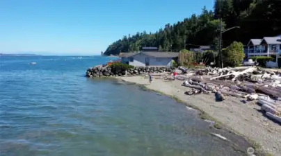 Stroll down the lane to private Tillicum Beach—enjoy exclusive access for kayaking, paddleboarding, and relaxing by the water.