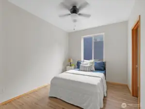 A full bedroom and bathroom on the main floor make the home ideal for guests, in-laws, or multigenerational living.