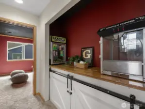"Concession stand" - with sliding barn door enclosure, you can make this extra storage space!