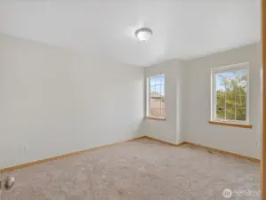 Two more oversized bedrooms upstairs provide plenty of room for family, guests, or home offices.