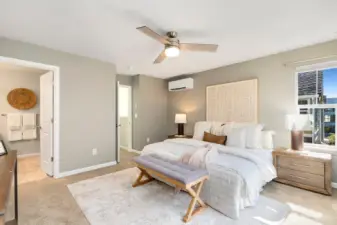 Spacious primary bedroom is on upper level.