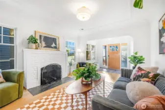 Wood burning fireplace with new tile hearth, fresh paint throughout, White Oak plank flooring.