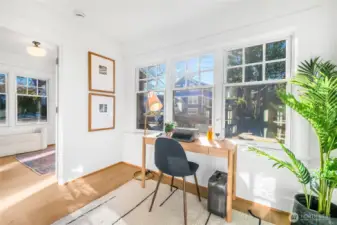 Front "office" flex space or use as an extension to the front bedroom. South facing with great light, walls of windows and can be fully closed off by french doors.