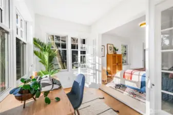 Another view of the front bedroom with the french doors open integrating the two rooms.