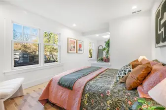 Second main level bedroom, West facing exposure plus sitting/dressing area.