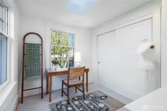 Dressing/sitting area and double closet off of main level bedroom.