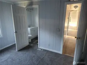 Bedroom #2 looking at hallway and shared bathroom with Utility Room