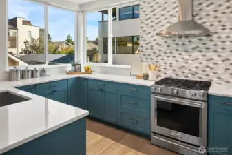 Kitchen with designer touches and huge windows.