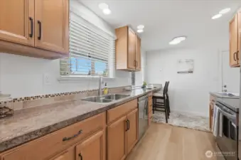 Remodeled kitchen with stainless appliances and eating nook. New interior paint throughout.