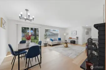 Living room with new luxury vinyl plank flooring throughout. Sliding door leads the backyard oasis. Light and bright!