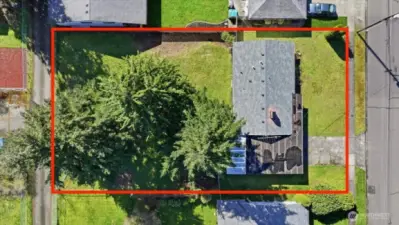 Large level backyard is fully fenced and offers alley access in back.