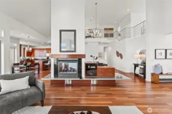 You'll love the creative, open layout with soaring ceilings.  Designed specifically for a concert pianist, the acoustics are incredible.  The double sided fireplace anchors the separation between the living and dining rooms, all the while keeping the open airy feel.