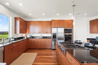The kitchen is just the right size with plenty of cabinets, office nook, and huge walk in pantry