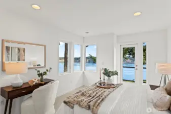 The two guest bedrooms on the upper level are mirror images designed to showcase the wate views, with doors to an upper deck.