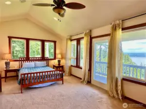 The upper primary bedroom has a deck, large walk-in closet, fireplace & full ensuite with jetted tub.