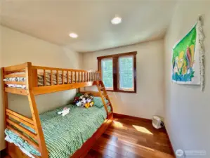 A separate suite/4th bedroom with a large living space, sleeping quarters and ¾ bathroom.